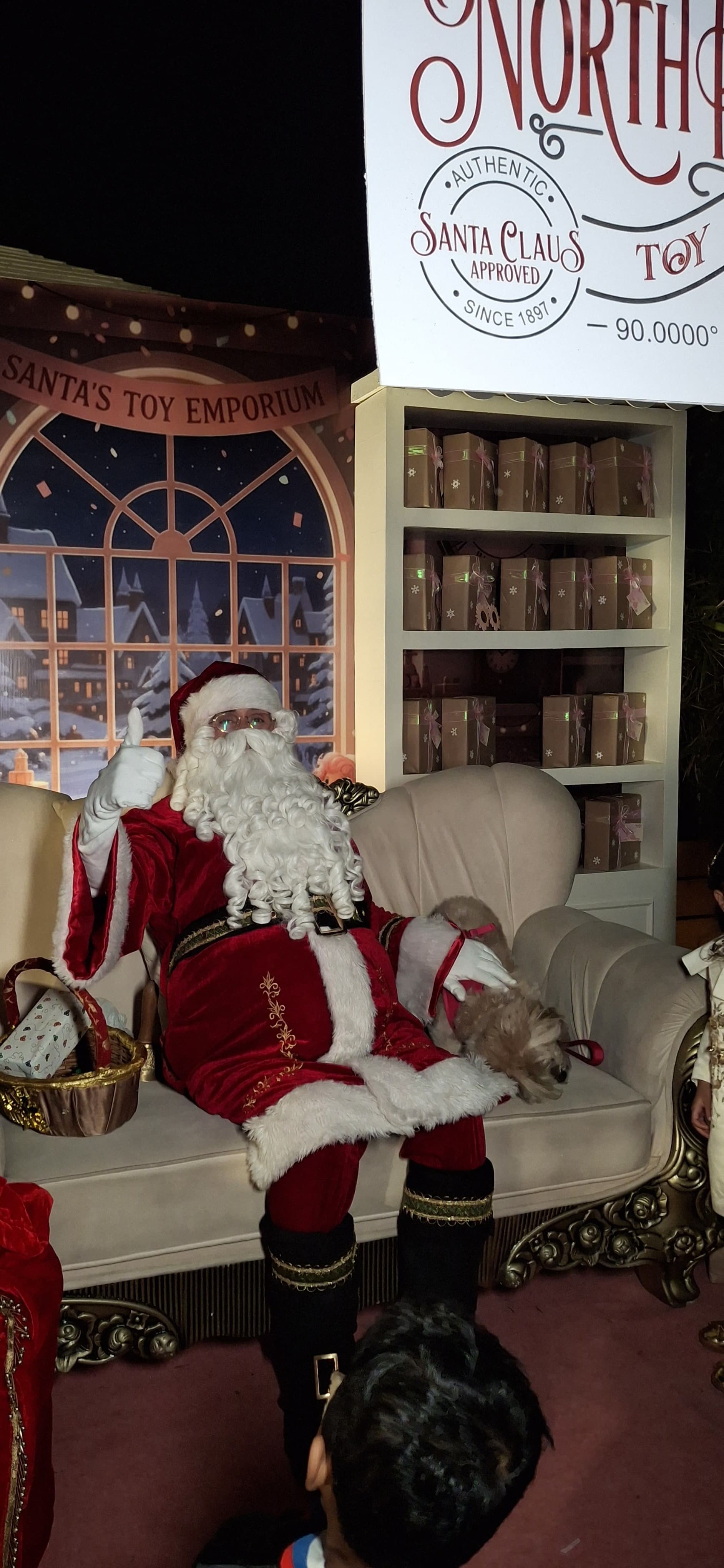 Santa kneeling to meet a child eye to eye