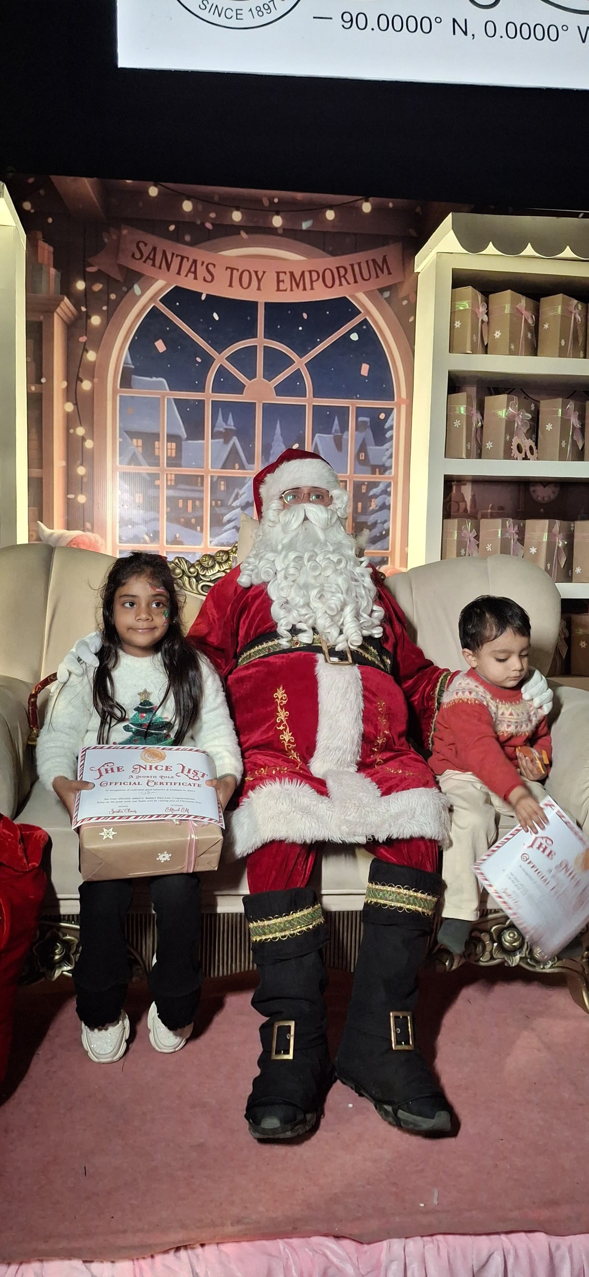 A teenager laughing as Santa greets them
